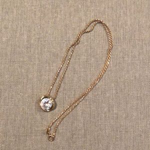 Gold necklace with a diamond charm